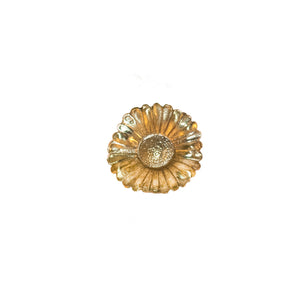 A decorative brass knob shaped like a adorned daisy, perfect for adding floral elegance to your decor