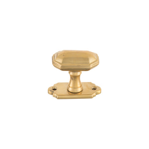 A brass knob with a polygonal shape, perfect for modernizing your decor.