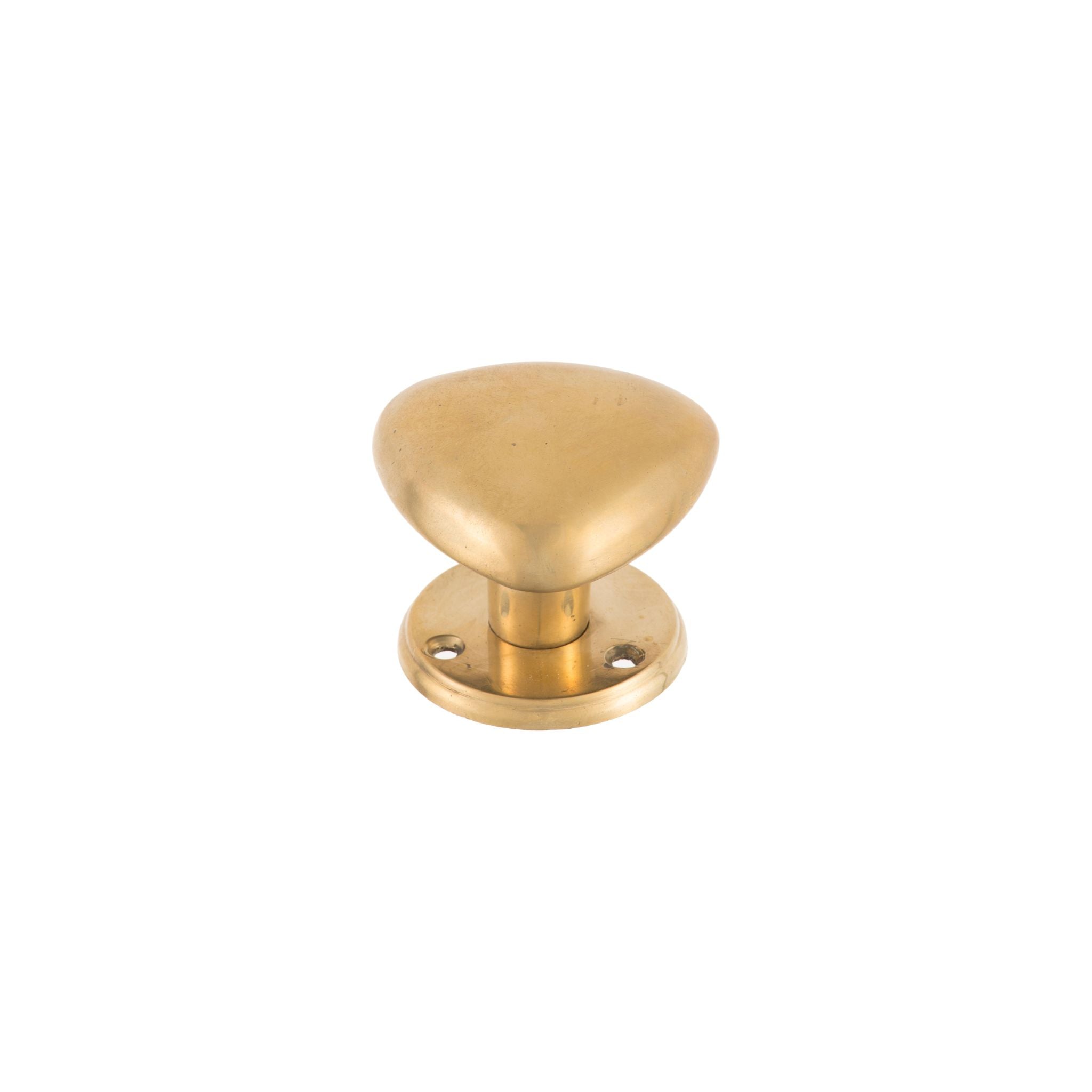 A brass knob shaped like a triangle, adding modern geometric flair to your decor.