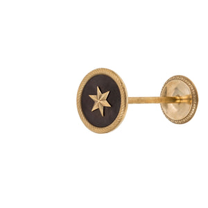 An elegant brass curtain tieback featuring a finely detailed star design. The tieback has a smooth, polished surface, with the star motif delicately raised to add texture. Its classic brass finish reflects a warm glow, perfect for enhancing the beauty and sophistication of any room.