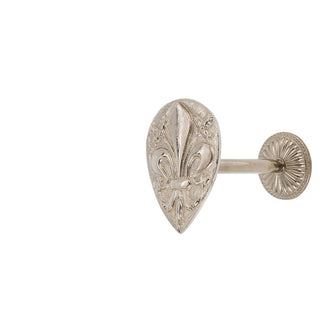 A finely crafted brass curtain tieback featuring a raised Florentine lily motif. The lily design is intricately detailed, with smooth, polished brass that catches the light beautifully. This elegant piece reflects classic Italian artistry, adding a touch of heritage and refinement to any room.