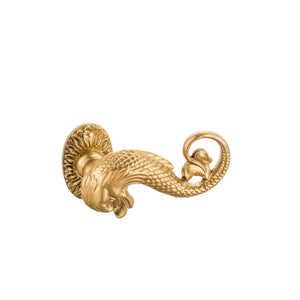 This is a brass door handle with a unique triton motif, featuring a decorative figure inspired by the mythological sea god. The handle is solid, with a smooth, polished brass finish that feels warm to the touch and has a golden luster. The triton detail is raised, offering a textured, intricate design that stands out visually and to the touch. Its ergonomic shape allows a comfortable grip, adding both aesthetic appeal and functionality, ideal for classic and luxury interiors.