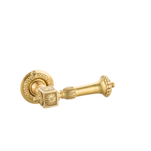 This door handle is crafted from solid brass with an intricate decorative design that adds elegance to any door. The handle has a smooth, rounded shape for a comfortable grip, while the decorative elements are raised, allowing fingers to feel the refined details and textures. The brass has a warm, golden tone with a subtle polished finish, creating a luxurious, timeless look that complements various interior styles.