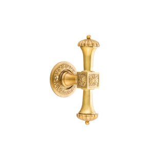 This window handle is crafted from solid brass and features an elegant decorative design, adding a touch of sophistication to any window. The handle is smooth and rounded, making it comfortable to hold and easy to operate. The decorative details are subtly raised, allowing fingers to trace the intricate patterns and feel the texture. The brass has a warm, golden finish with a soft sheen, providing a timeless look that complements both traditional and modern interiors.