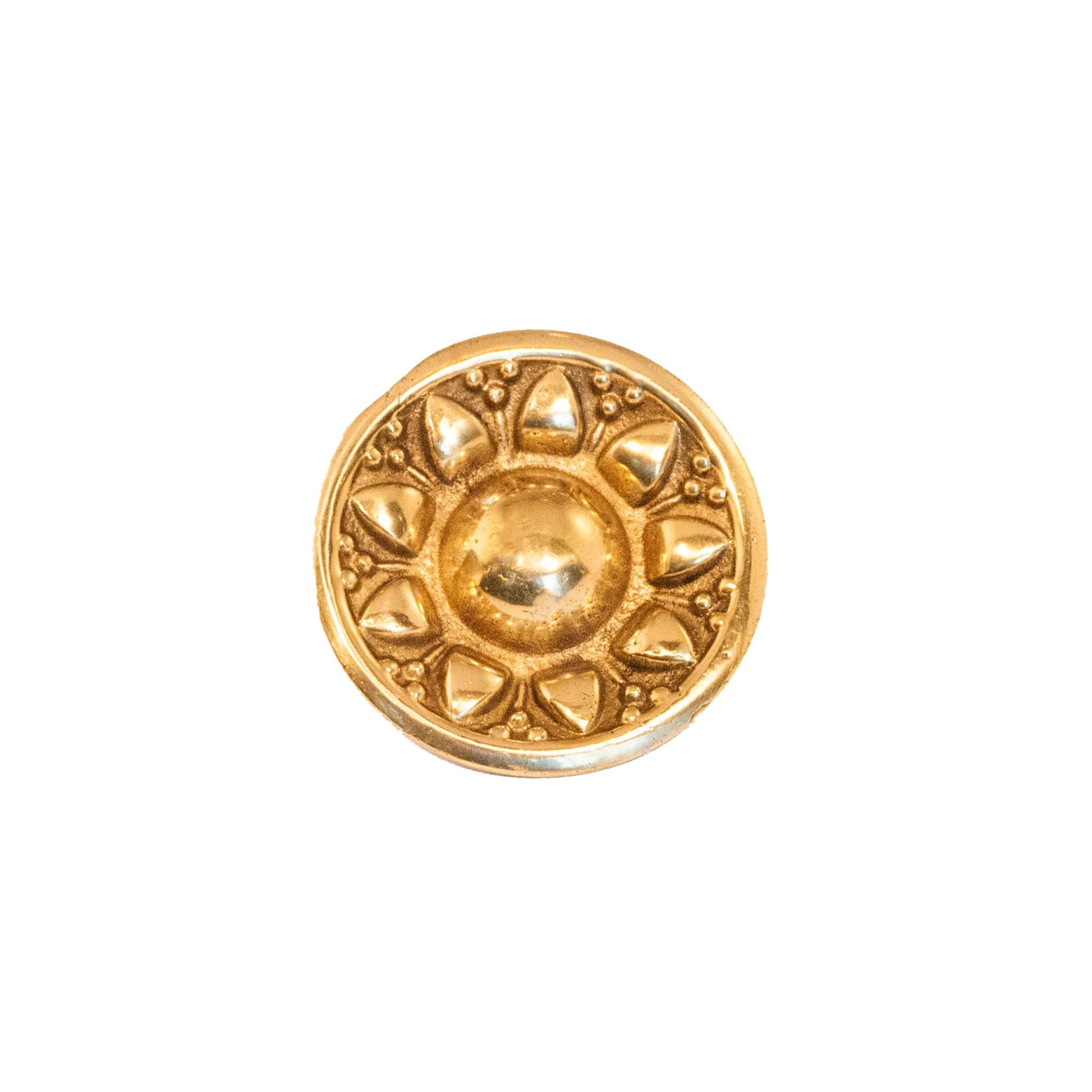 Novecento Budapest Brass Knob: A circular brass knob featuring a sun-shaped decoration, perfect for adding a touch of brilliance to your décor.