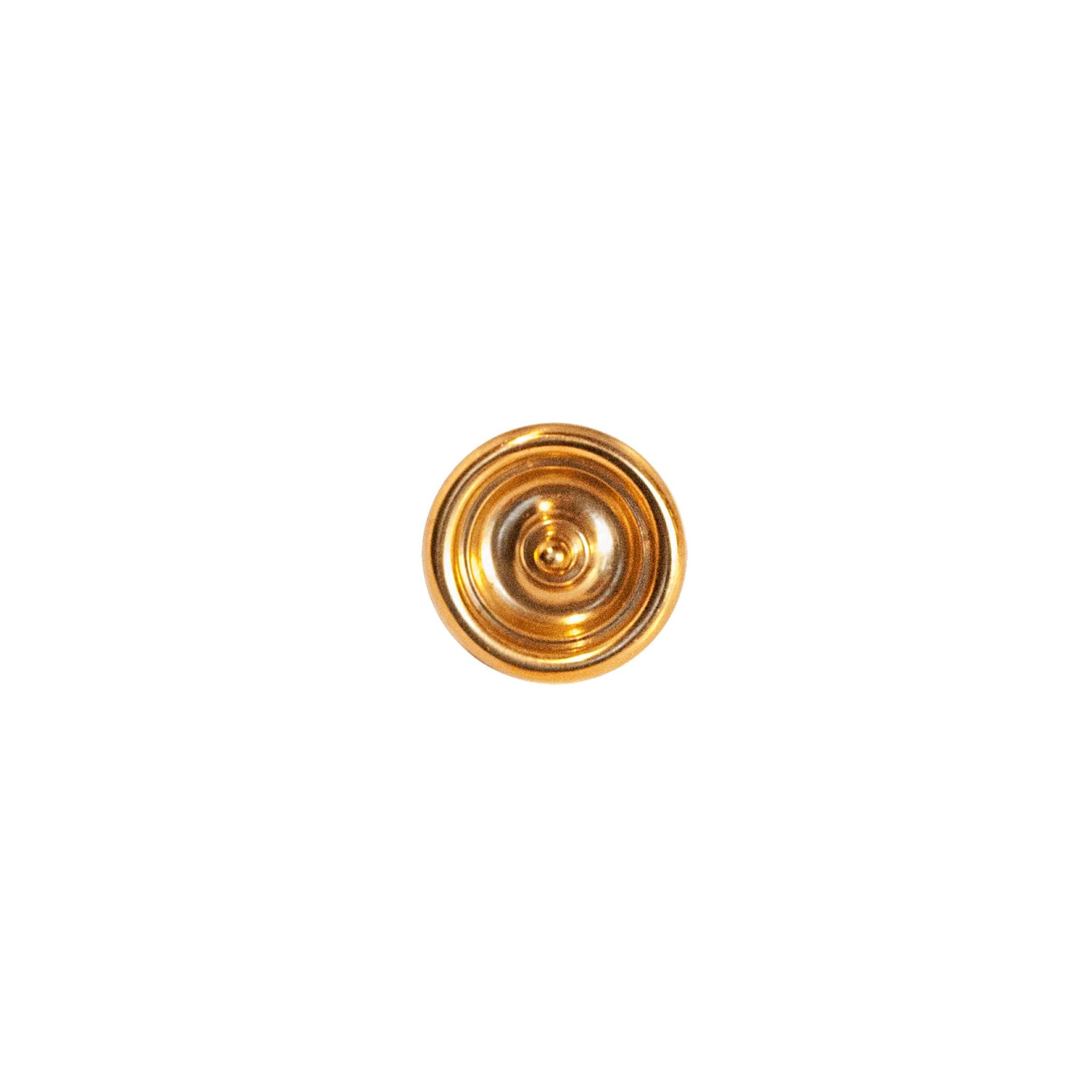 A decorative circular brass knob with a polished finish, featuring intricate detailing around the edges, designed for use on cabinets, drawers, and furniture.