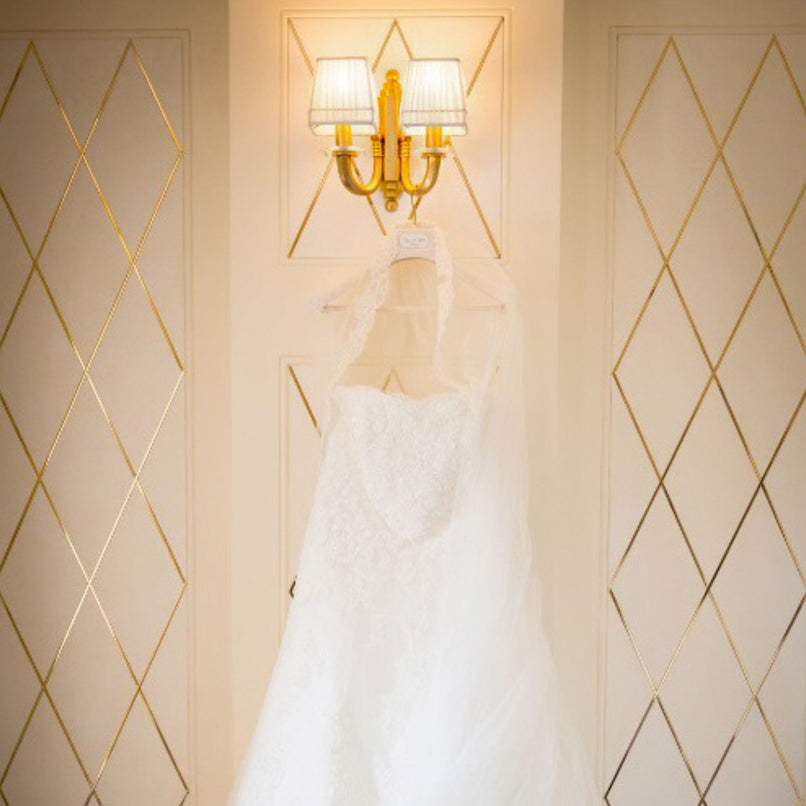 Novecento two-lights brass wall sconce with extra clear glass elements