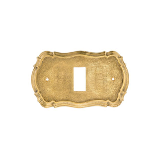 This switch plate is crafted from solid brass, featuring a smooth and polished finish. Its surface is flat with rounded edges, giving it a comfortable feel and a timeless look. The brass material is warm to the touch and adds a refined, elegant accent to any wall. Designed to fit around light switches, this plate combines functionality with a sophisticated appearance that enhances any interior space.