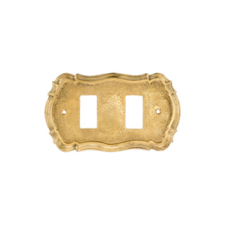 This brass switch plate is designed with a smooth, polished surface and gently rounded edges. The plate is flat and fits seamlessly around light switches, providing an easy-to-feel, sturdy cover. The brass material has a warm, solid feel and a refined appearance, adding a timeless elegance to any wall. Functional and stylish, it enhances the overall look of any space.