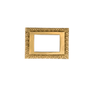 This switch plate is made from solid brass, featuring a polished, smooth surface with gently rounded edges. Its flat design fits snugly around light switches, creating a secure and easy-to-locate cover. The brass material feels warm and sturdy, giving a sense of classic elegance and adding a decorative touch to any wall