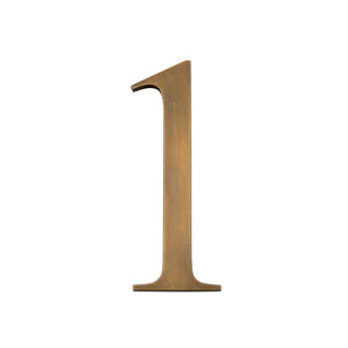 This is a small house number 1, crafted from solid brass. It features a smooth, polished surface with a sleek and elegant finish. Its compact size makes it ideal for a discreet yet stylish addition to any exterior, whether modern or classic. The durable brass material ensures long-lasting quality.