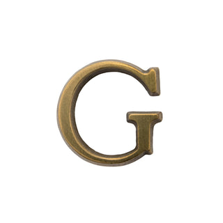 This is a medium-sized letter G, made of solid brass. It features a smooth, polished surface with an elegant and timeless finish. The design is versatile, suitable for modern and classic settings, and its durable construction ensures long-lasting quality. Perfect for adding a personalized touch to your home's exterior.