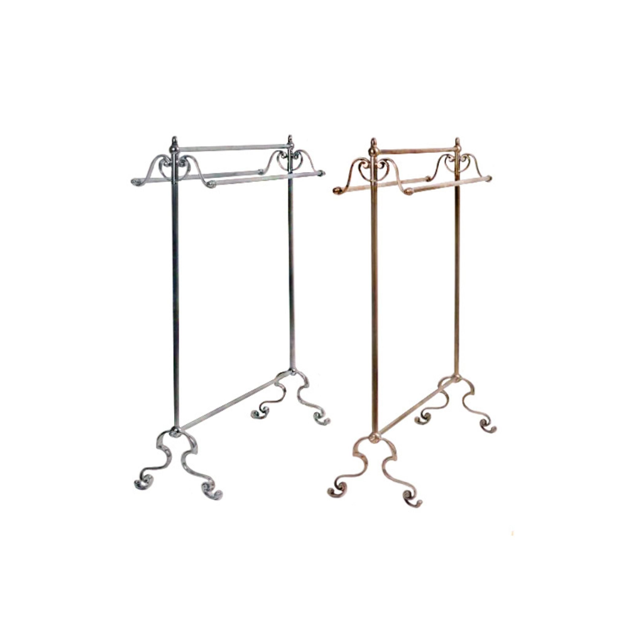 A freestanding towel holder made of solid brass with a sleek, minimalist design. The holder features a stable base and vertical rods for neatly hanging towels. Its polished surface adds a warm, luxurious touch, perfect for enhancing bathroom decor.