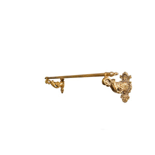 A brass towel holder with a grooved tube design, featuring finely crafted ridges for a textured and elegant appearance. This sturdy and polished accessory is designed for wall mounting, offering both functionality and sophistication. Handcrafted in Italy, it complements both modern and traditional bathroom styles with timeless charm.