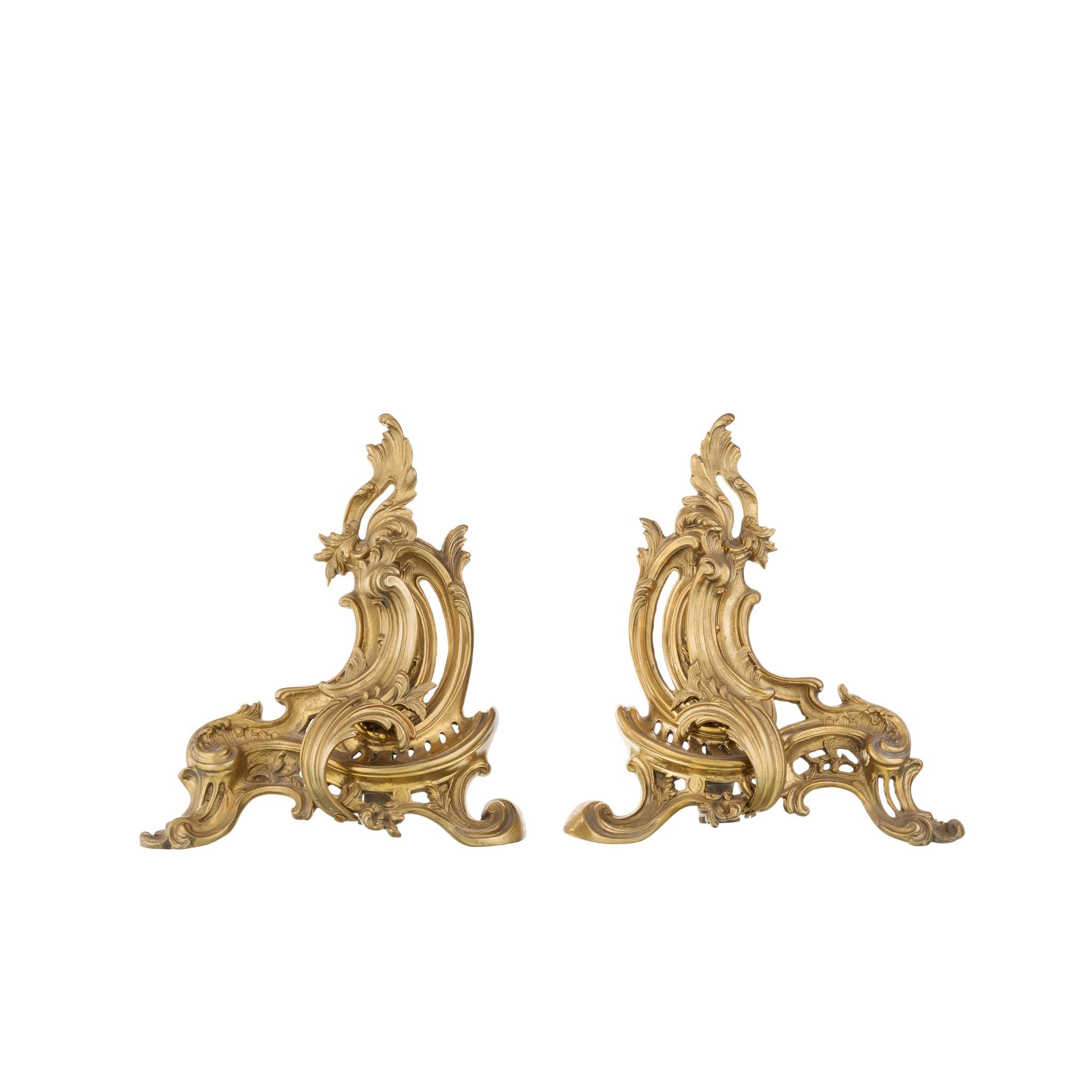 Our decorative brass and iron andirons are a harmonious blend of strength and artistry. Each andiron features a solid iron base with a slightly textured surface, ensuring stability and secure firewood support. The top is adorned with intricately crafted brass decorations, offering a smooth and polished feel. These detailed designs add a touch of elegance and a classic aesthetic to your fireplace. The andirons are both functional and ornamental.