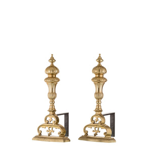 "Our brass and iron andirons are designed to combine strength and elegance for your fireplace. Each andiron features a solid iron base with a slightly textured surface for stability and durability. The upper section is adorned with smooth, polished brass accents, offering a sleek and cool-to-the-touch feel. The minimalist yet refined design makes these andirons both functional, securely holding firewood in place, and decorative, enhancing the aesthetic of your fireplace.