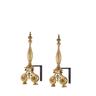 "Our brass and iron andirons are a perfect blend of strength and elegance, crafted to enhance both the functionality and beauty of your fireplace. The base is made of robust iron with a slightly textured surface, providing stability and secure support for firewood. Rising from the base are smooth, polished brass accents that feel cool to the touch, adding a refined and timeless aesthetic. The design is minimalist yet sophisticated, making these andirons suitable for both modern and traditional hearths.