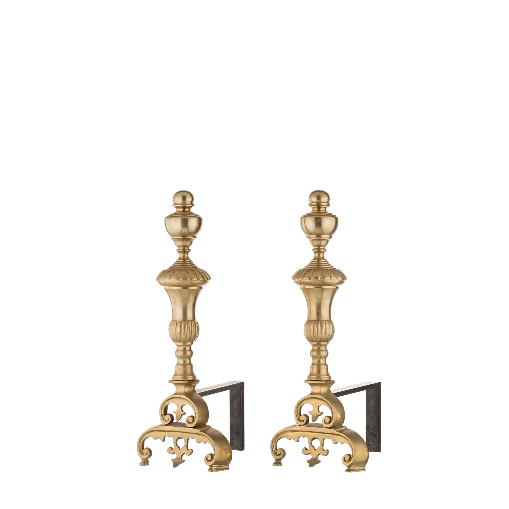 Our brass and iron andirons are a combination of strength and elegance, designed to enhance your fireplace both functionally and decoratively. The base is crafted from sturdy iron with a slightly textured surface, ensuring stability and secure firewood support. Polished brass accents adorn the top, offering a smooth and cool-to-the-touch feel, adding a refined aesthetic. 