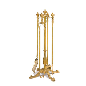 This fireplace tool set is crafted from brass, featuring a warm, golden finish with a polished, smooth surface. The standout design element is the lion paw feet, intricately detailed to add a touch of classic elegance. The set includes essential fireplace tools such as a poker, tongs, a shovel, and a brush, each with matching brass handles for a cohesive look. The tools are sturdy and well-balanced, designed for practical use while enhancing the aesthetic appeal of your fireplace area. 