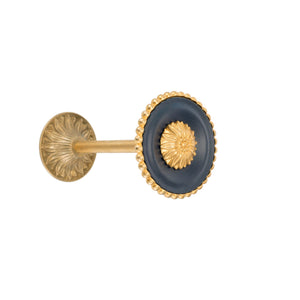 A circular brass tieback with a smooth, polished finish and a simple, round design. It feels sturdy to the touch and has a timeless elegance, ideal for securing curtains in place with a refined, understated look.