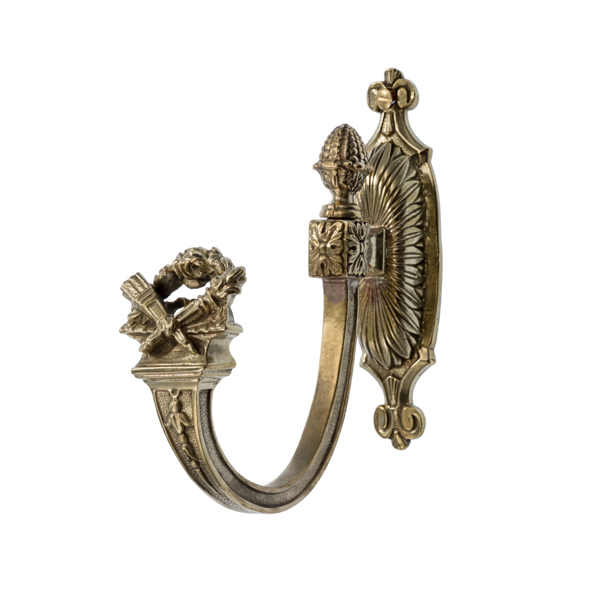 This curtain tieback is crafted from solid brass with a polished, decorative design. It feels smooth and substantial in the hand, with a classic, elegant shape that holds back curtains securely. The warm brass material adds a touch of timeless sophistication, making this tieback both a practical and stylish addition to any room.