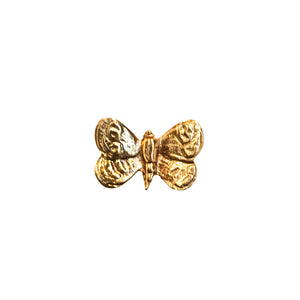 An image of a small brass butterfly-shaped knob against a neutral background. The knob features intricate detailing resembling butterfly wings, adding a touch of elegance and whimsy to furniture or drawers.