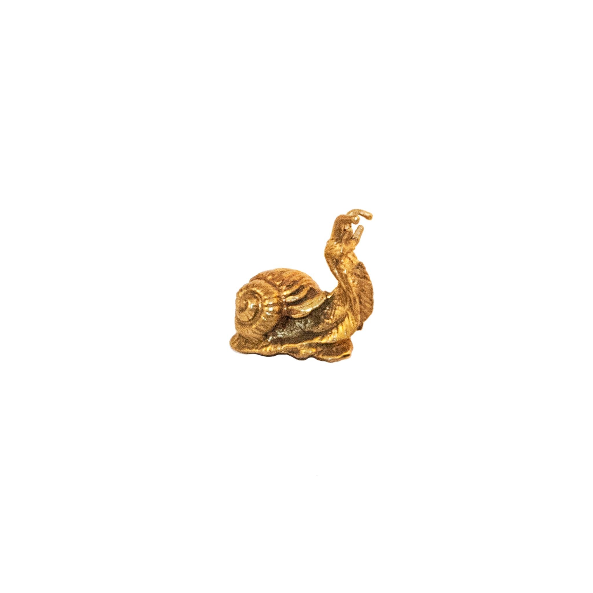 A medium-sized brass knob shaped like a snail, featuring detailed craftsmanship.
