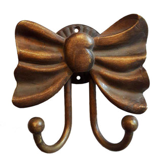 A decorative coat hook crafted from solid brass, designed in the shape of a delicate bow. The hook features a polished, smooth finish and a sturdy construction, making it both functional and visually appealing. Perfect for hanging coats, hats, or accessories, adding a charming and elegant detail to any room.