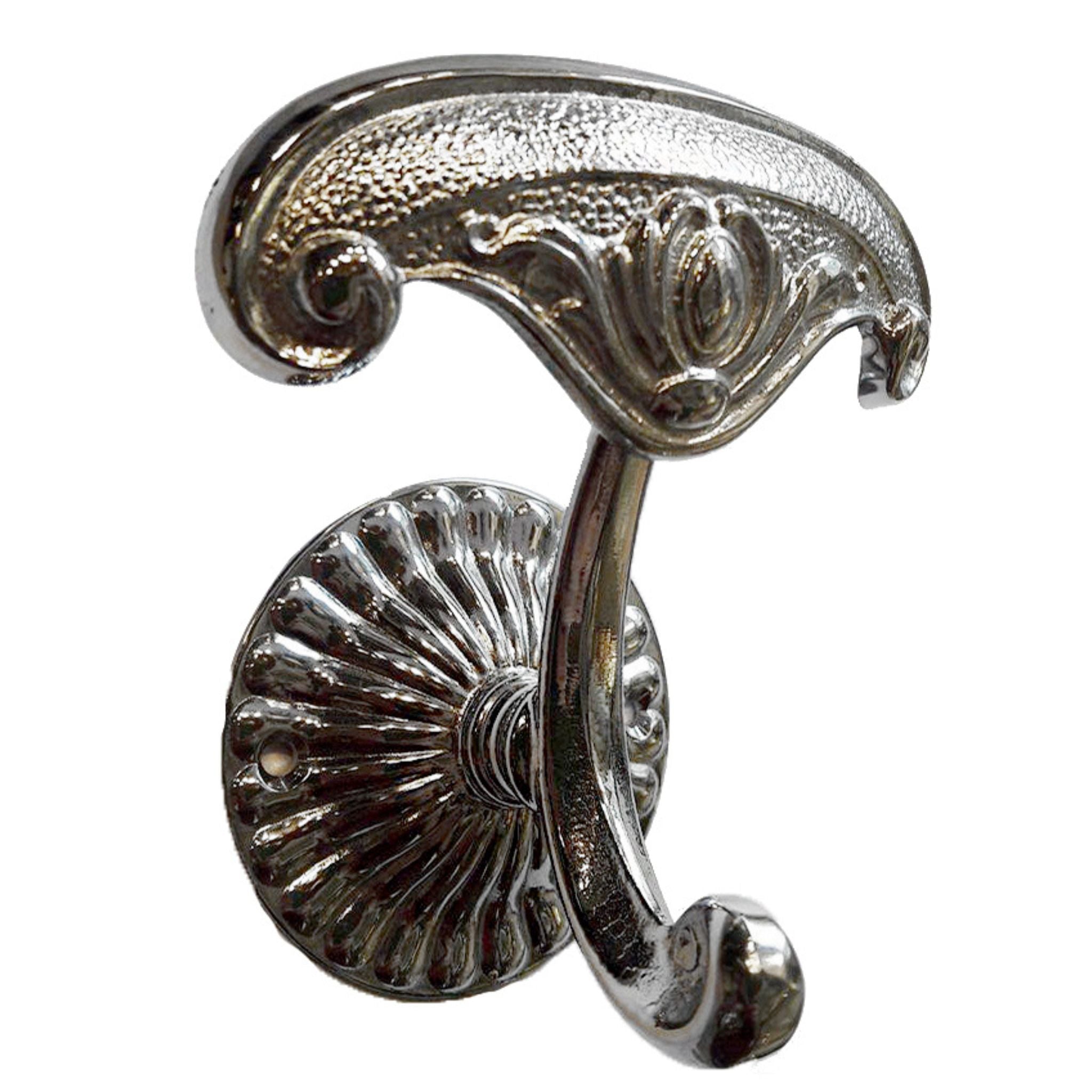 A decorative brass coat hook with an ornate design. The hook has a smooth, curved shape, perfect for hanging items like coats, hats, or bags. The brass material has a polished, golden finish that gives it a vintage and elegant appearance. The base of the hook features intricate detailing, adding a touch of sophistication to any space.