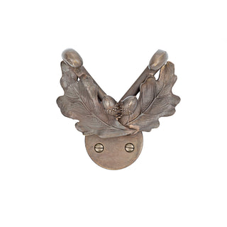 A brass coat hook adorned with a detailed oak leaf design. The hook has a polished, smooth finish, and the leaf motif adds a touch of natural elegance. Sturdy and decorative, it’s ideal for hanging coats, hats, or accessories.