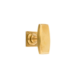 This is a square-shaped window handle crafted from solid brass with gently rounded edges, giving it a soft, elegant look. The brass has a smooth, warm finish, making it both visually appealing and comfortable to grip. Its minimalist design allows it to blend seamlessly with various interior styles, adding a sophisticated touch to any window while offering easy functionality.