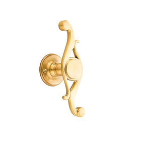 This window handle is crafted from solid brass and features a distinctive scroll shape. It has a smooth, curved design, providing a comfortable grip and ease of use. The handle has a polished surface with a warm, metallic feel, making it both functional and elegant. Its classic style is suitable for enhancing the charm of any room, fitting well with both traditional and contemporary decor.