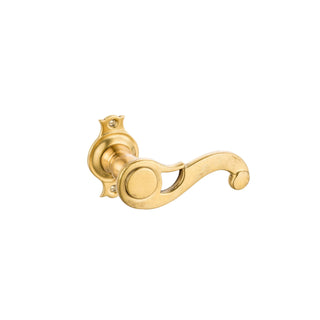 A small brass door handle with a smooth, polished finish and an elegant curl shape. The surface is sleek to the touch, providing a comfortable grip. Ideal for interior doors, its classic design and durable material make it perfect for spaces that seek a touch of timeless style.