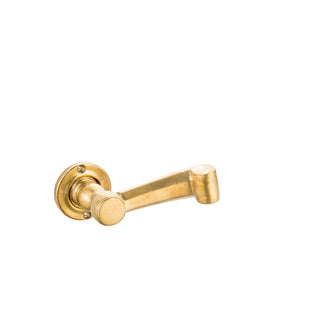 This small door handle is made from solid brass in a graceful scroll shape. Its compact, curved design offers a comfortable and secure grip, suitable for various hand sizes. The handle has a polished, warm metallic surface, providing a smooth touch and classic appeal. Ideal for adding a refined accent to doors in both traditional and modern spaces