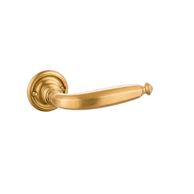 This door handle is crafted from solid brass in a distinctive polygonal shape. The geometric design features clean edges and angles, creating a bold and modern feel. Its surface is smooth and polished, offering a warm metallic touch that