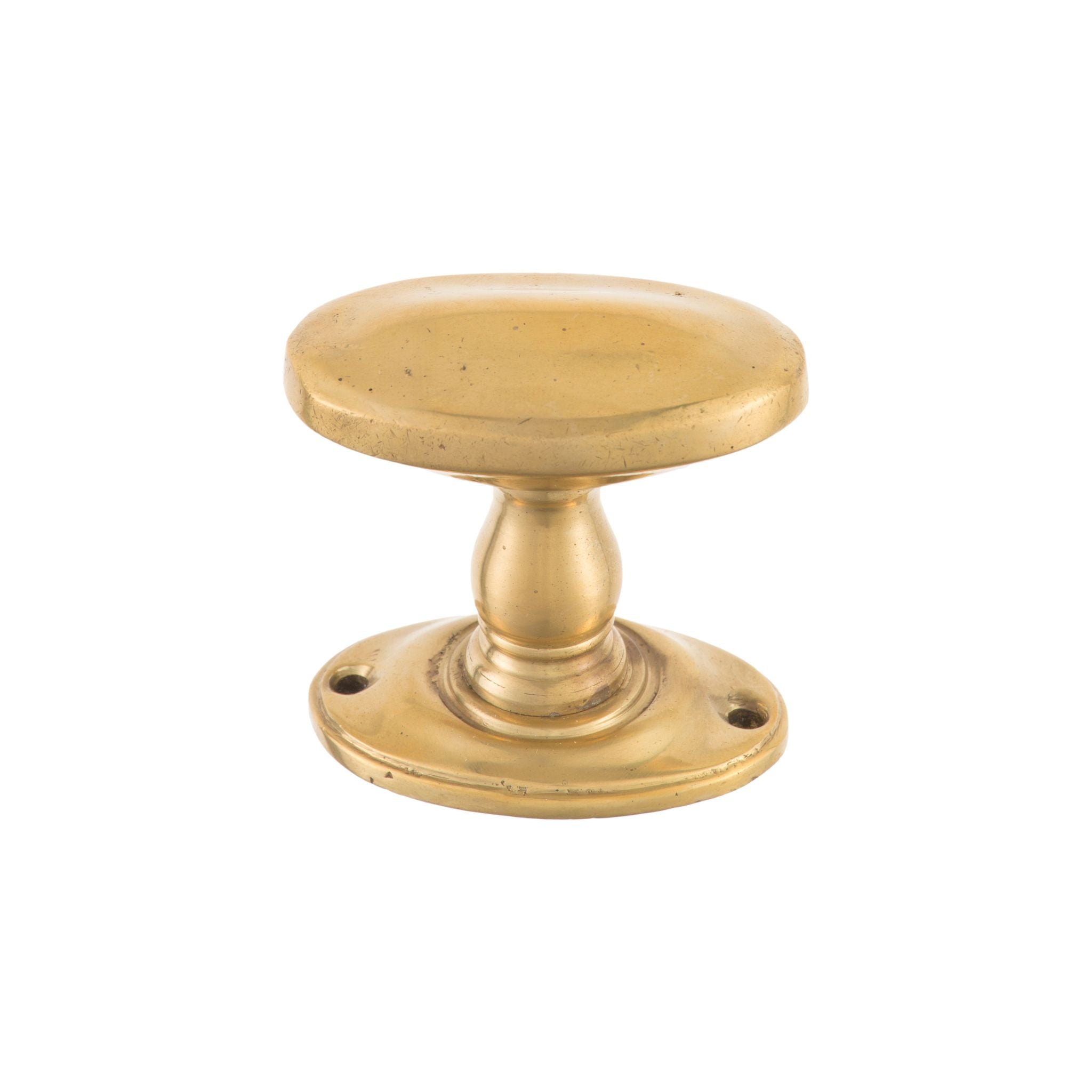 Oval brass knob with a smooth, polished finish, suitable for cabinets, drawers, and doors.