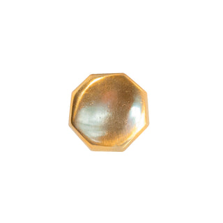 A polished hexagonal brass knob with a modern and elegant design, suitable for cabinets, drawers, and doors.