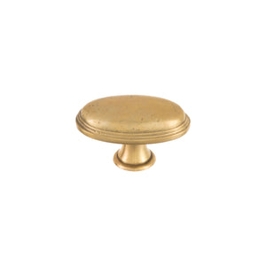 Oval brass knob with a smooth, polished finish, suitable for cabinets, drawers, and doors.
