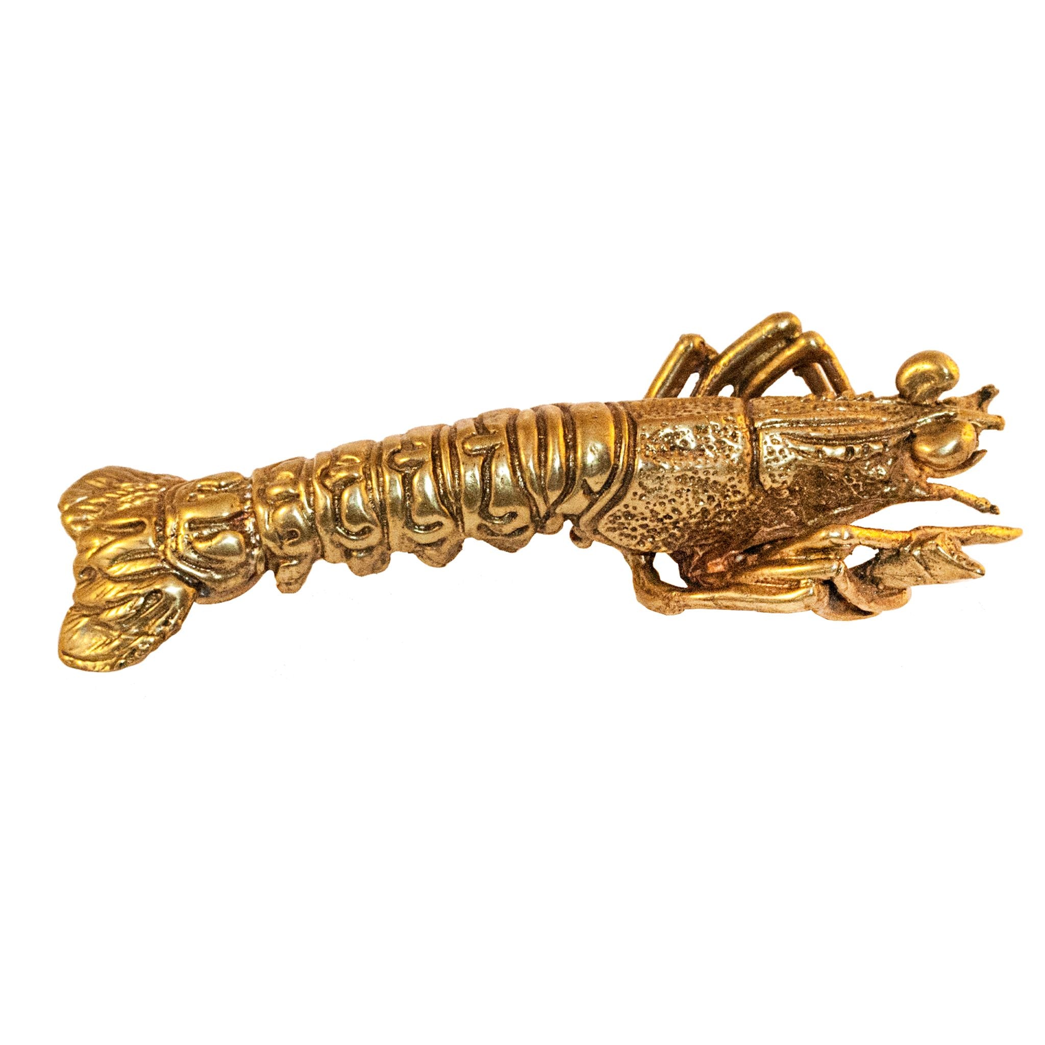 A brass knob shaped like a lobster.