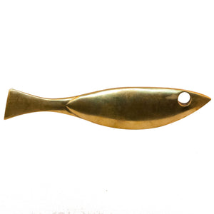 A simple brass knob shaped like a fish.