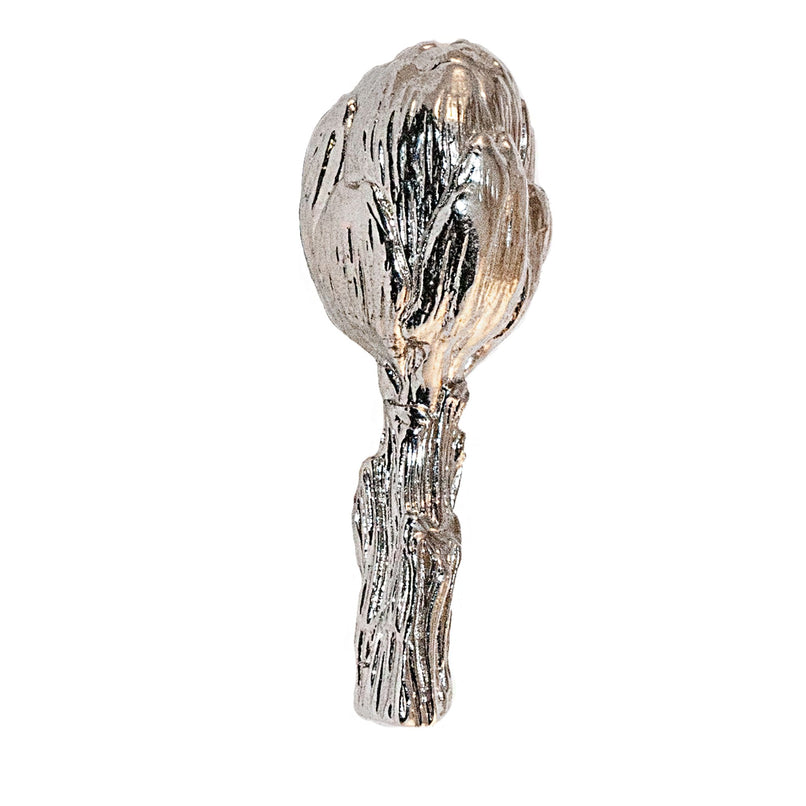 An image of a small brass artichoke-shaped knob against a neutral background. The knob features intricate detailing resembling an artichoke, adding a touch of elegance and sophistication to furniture or drawers.