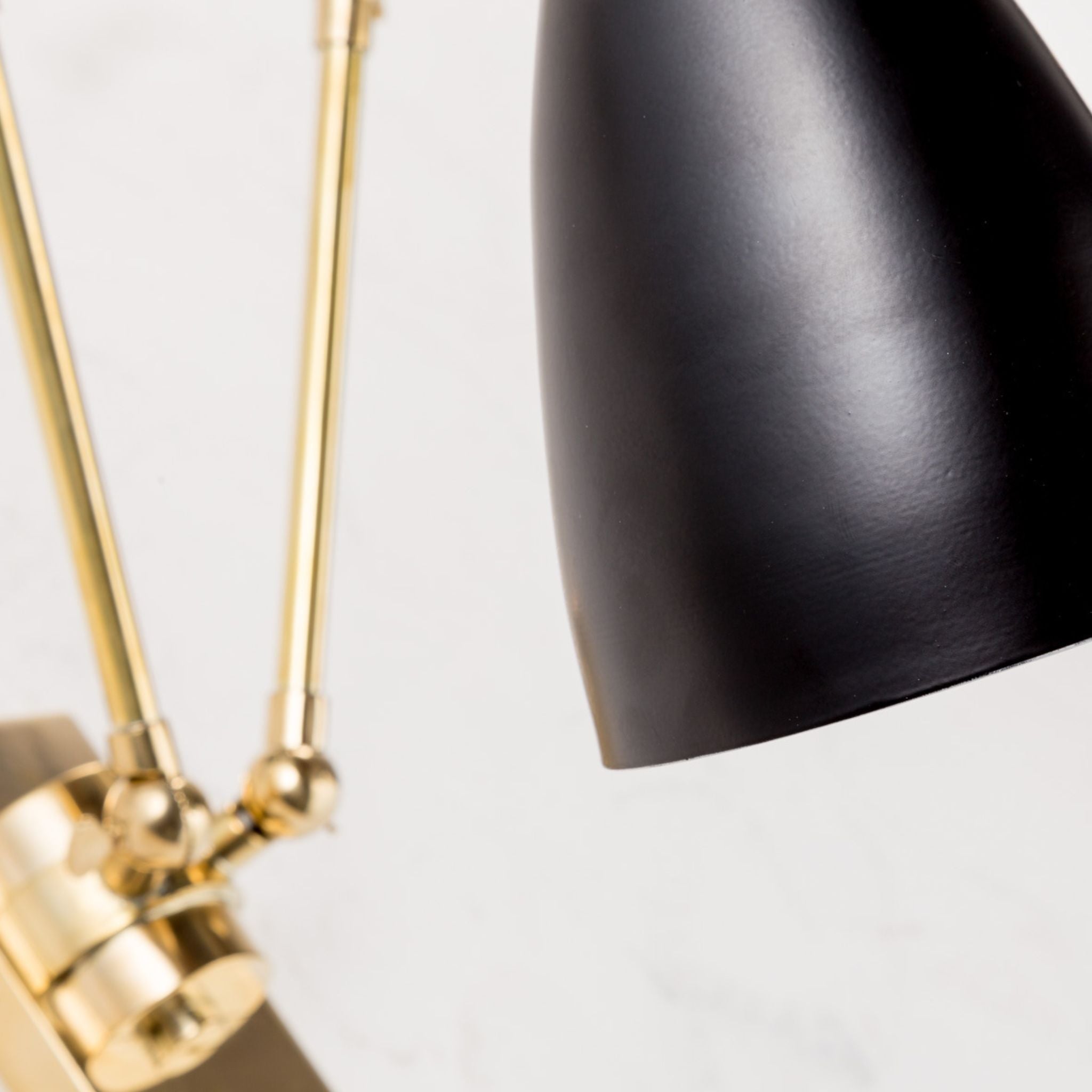 Wormhole jet black double joint arm brass wall light - ilbronzetto